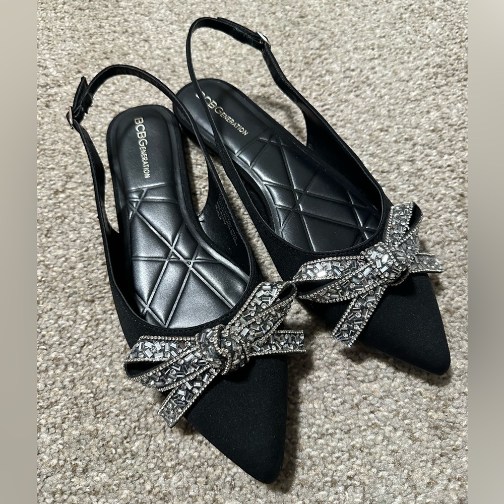 BCBGeneration Black Slip-ons with Silver Bow Detail